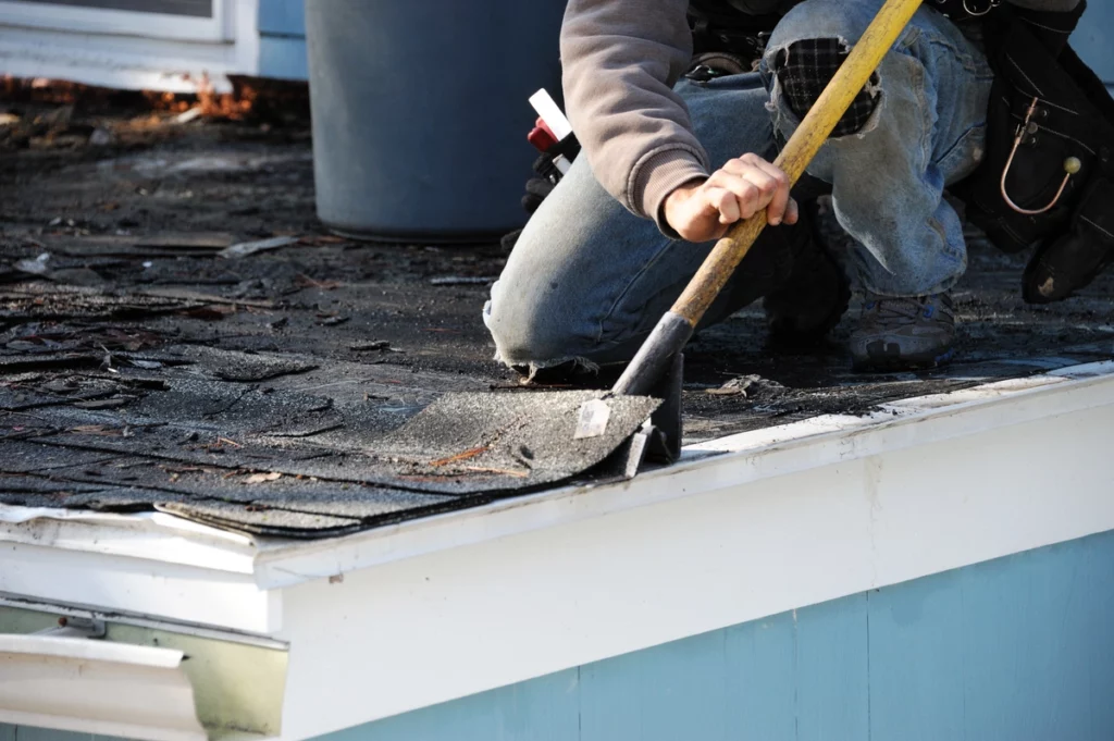 close up of roofing companies in Jupiter using roofing shovel
