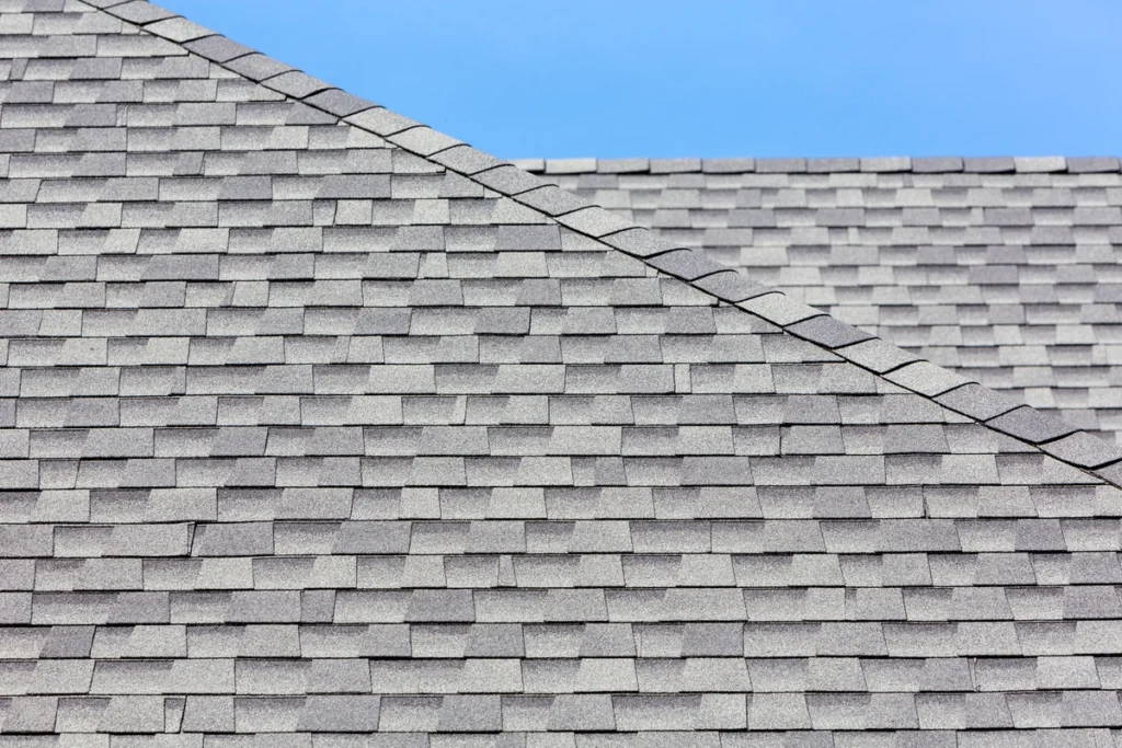 edge of a roof showing newly placed shingles